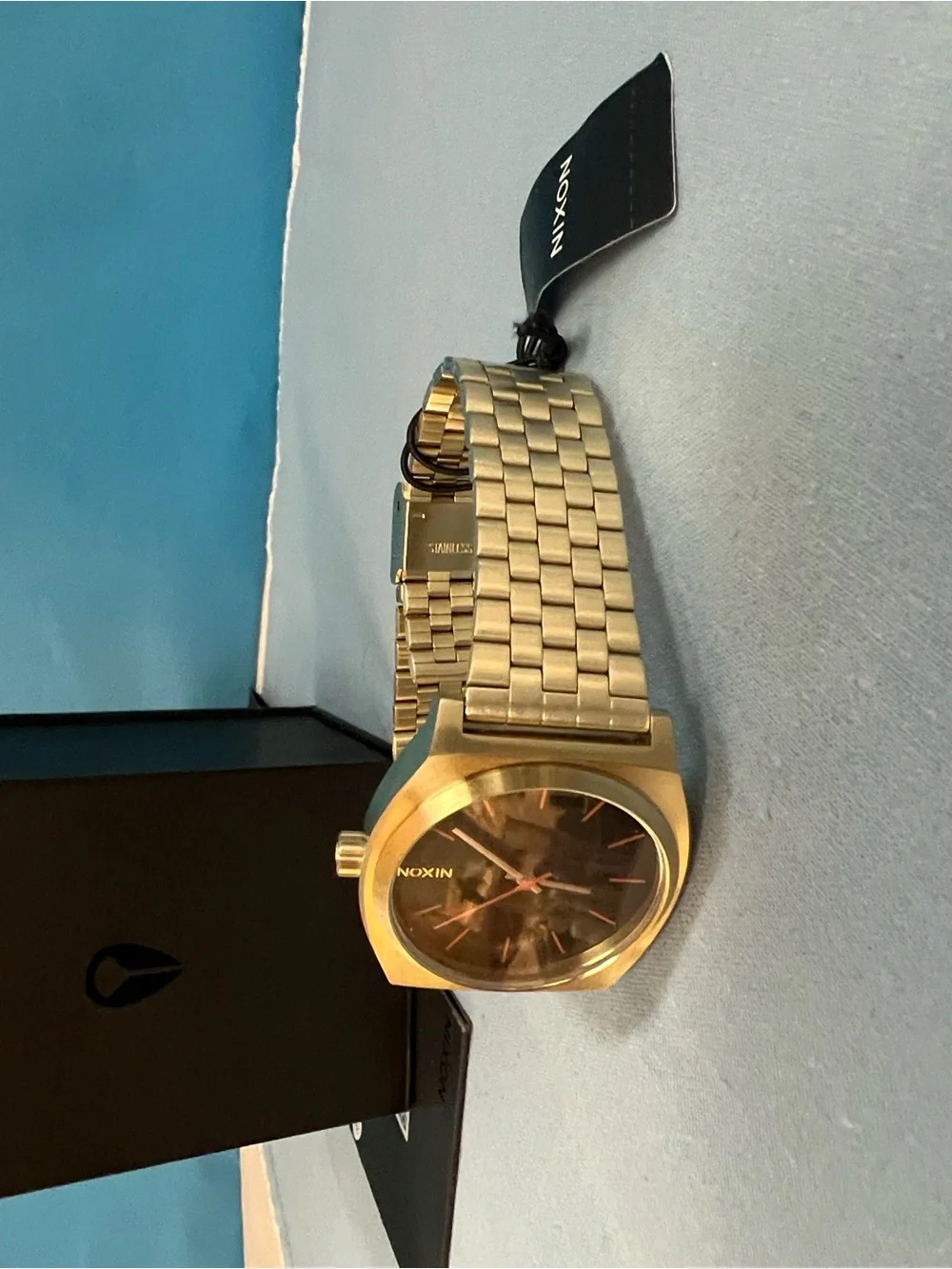 Nixon Gold Watch with Black Dial and Red Accents, Time Teller Model